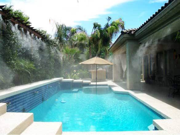 Backyard and pool with a patio misting system